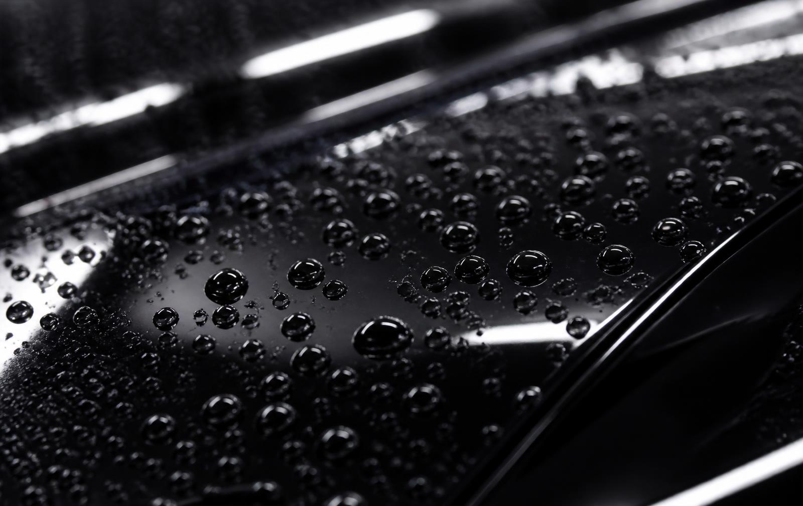 Water beading on a ceramic coated black paint surface