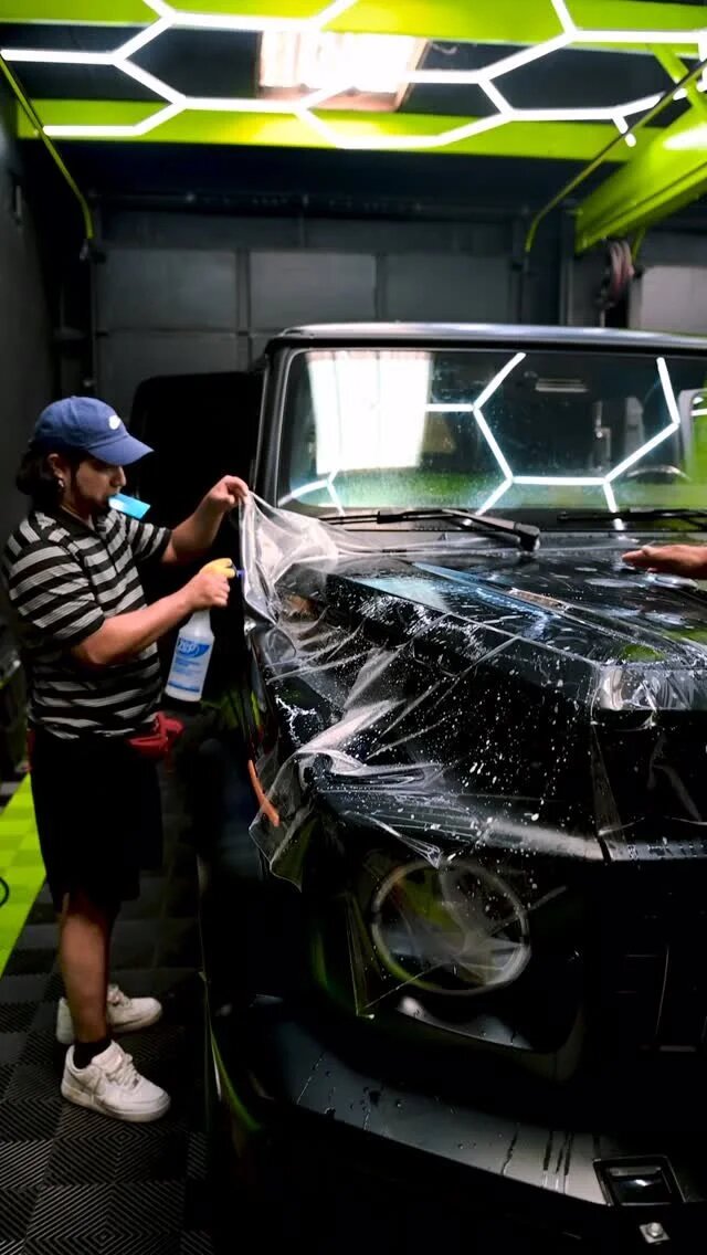 Paint protection film being installed on a Mercedes-Benz G-Class